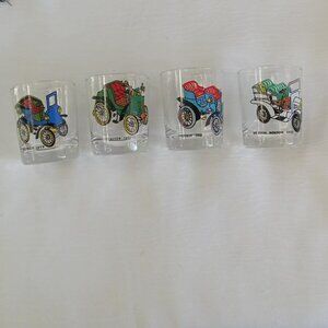 Collection of 4 vintage small glasses with a heavy base and old car designs